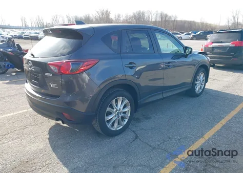 2015 Mazda Cx-5 Grand Touring z USA, uszkodzony, nr VIN JM3KE4DY8F0490897